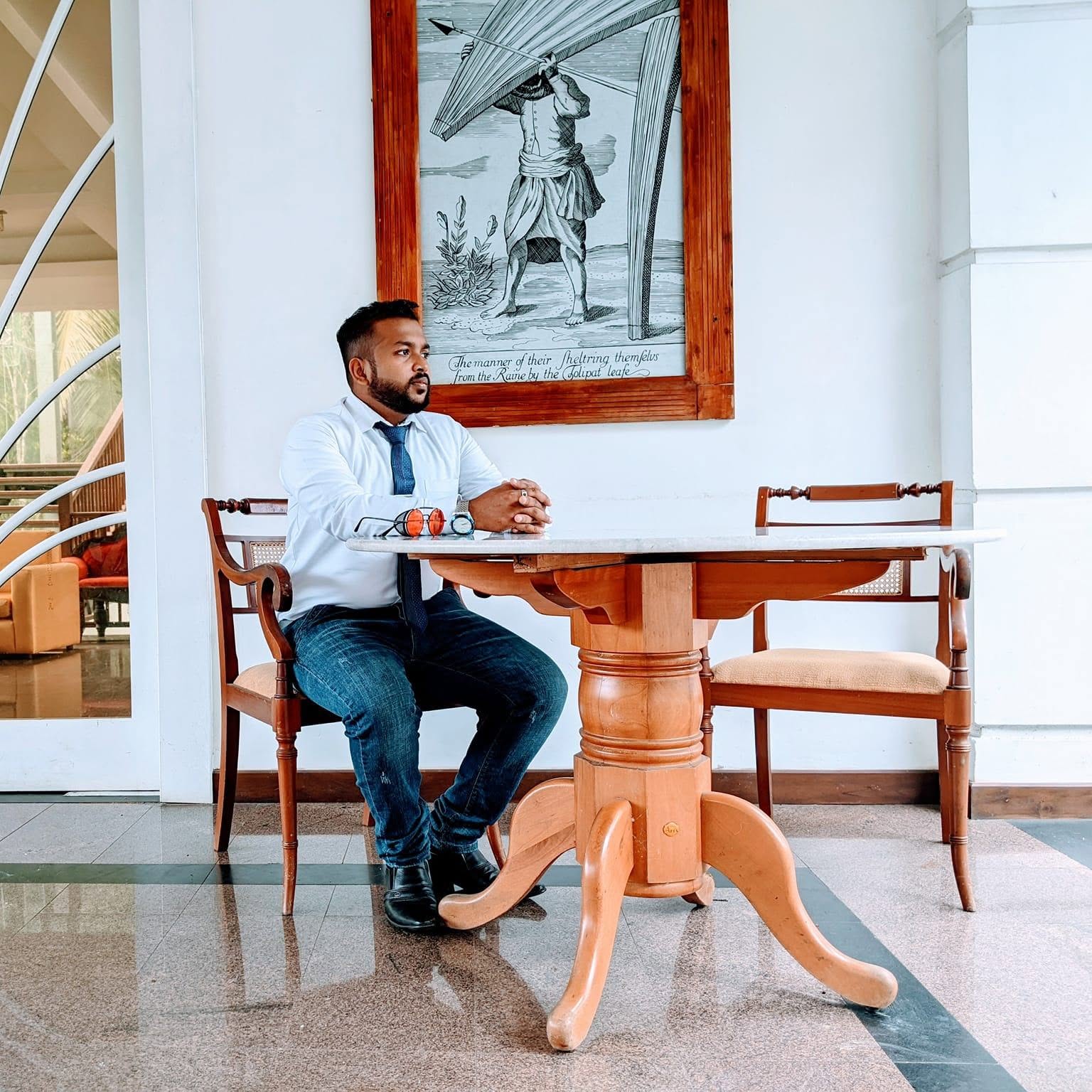 Rukmal D Samarajeewa seated at a study table